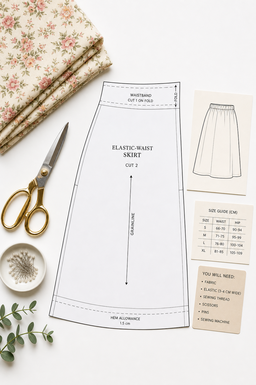 Elastic-waist skirt sewing pattern arranged with scissors and folded fabric on a bright studio background